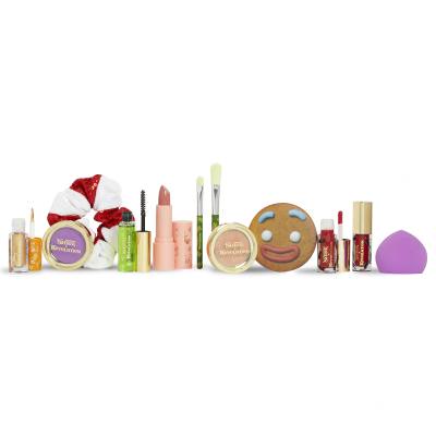 Makeup Revolution London Shrek Gingy 12 Days Advent Calendar Dárková kazeta oční stíny 2 ks + rozjasňovač 1 ks + lesk na rty 2 ks + rtěnka 1 ks + tvářenka 1 ks + gel na obočí 1 ks + štětec 2 ks + houbička na make-up 1 ks + zrcátko 1 ks + gumička na vlasy 1 ks